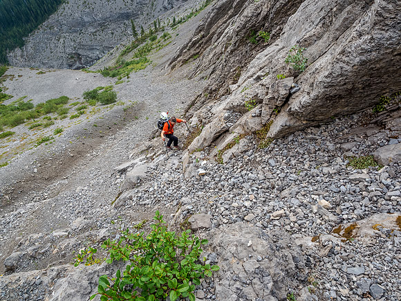 Phil starts up the base of our access gully through the headwall.