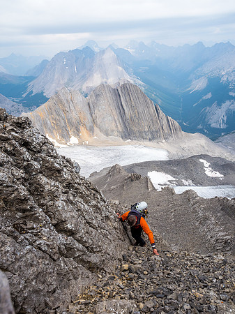 Looking back at Phil ascending just past the crux in the gully. Kane's abutting ridge and approach moraine far below and looking flat (it isn't).