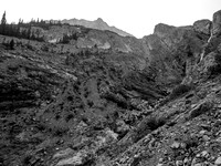 We have started up the right side of the creek (falls at right) but you can clearly see the two scree ramps at left that look very simple and also lead to the upper NW bowl.