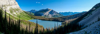 Views back over a very full Hidden Lake towards Mount Indefatigable.