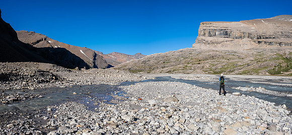 Phil traverses under Mount Harris back to our bivy.