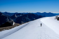 Phil traverses to the east peak with Malloch in front of him.
