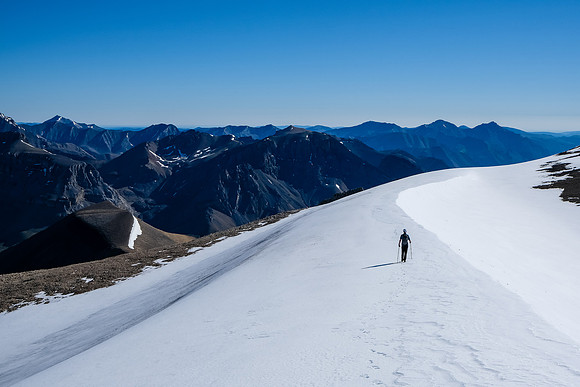 Phil traverses to the east peak with Malloch in front of him.
