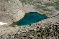 A tarn tucked under our ascent ridge.