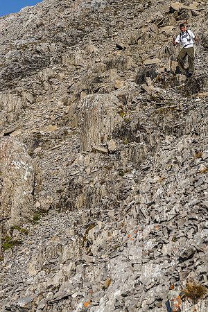 Jon descends more rubble towards the west side of the south ridge of Putnik.