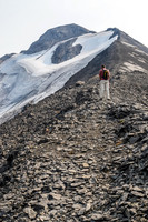 There is a good trail beaten into the scree. The only scrambling section other than the approach headwall is just above Jon here.