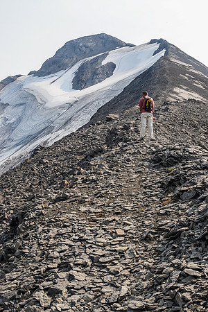 There is a good trail beaten into the scree. The only scrambling section other than the approach headwall is just above Jon here.