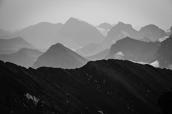 Mount Nivelle and the Castelnau Glacier are barely visible through the smoky haze. Other peaks around Nivelle include, McCuaig, De Gaulle, Castelnau and Ney.