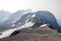 Looking back at Rod ascending the wide south ridge of Warrior, Cordonnier and its traverse along with Joffre in the background.
