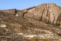 Jon grunts up to the scree ridge above the glacier - the summit visible above us here and the route via the skyline ridge.