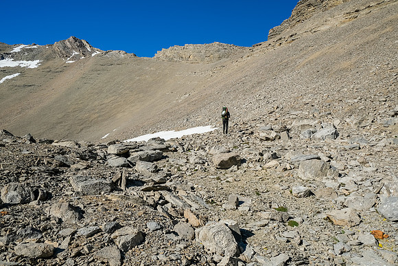 Hiking up loose shale and scree to the 2800m col at top center.