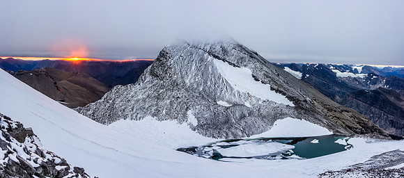 Looking down on the tarn between Willingdon and Crown - we weren't expecting that to be there! Note the thick cloud cover
