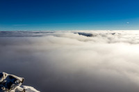Mount Harris is barely visible under the clouds.