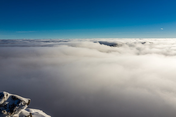 Mount Harris is barely visible under the clouds.