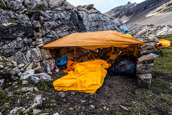 My setup for the bivy. Kept me dry through a LOT of rain! Rocks and trekking poles are critical to making this shelter work.