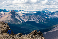 Ben descends the NW ridge. Conical, Porcupine and Noyes visible beyond.
