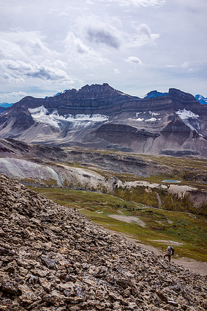 Ben comes up the lower scree slog on Devon's northwest ridge with Mosquito and Ramp in the distance.