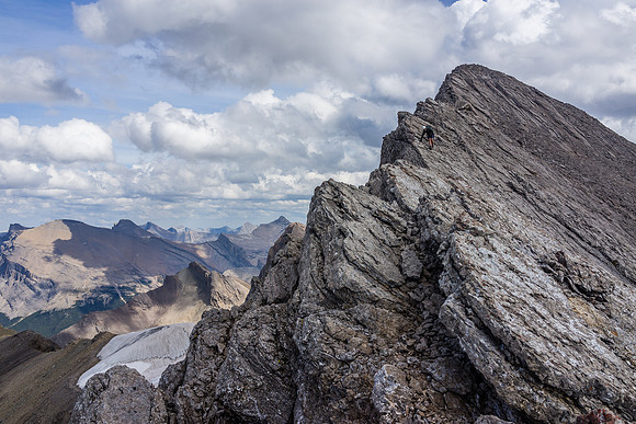 Descending the aesthetic NW summit ridge of Devon Mountain.