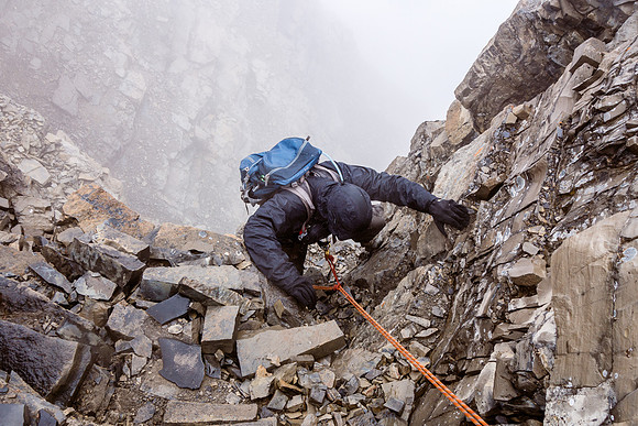 Eric's turn to climb up in a summer blizzard.