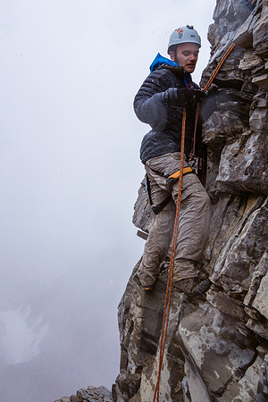 Ben climbs up the 5.3 step using a prussic on the rap rope for safety.