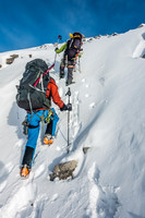 The sun is out now and we are boot packing up the steepish rubbly south slope of Peyto.