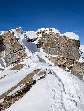Negotiating the crux on the ridge.