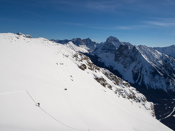 Looking back at Bill as I gain the upper slope under the summit ridge.