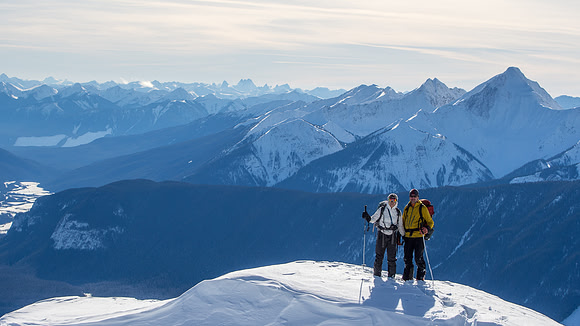 Raf and Helen pose just before the summit. You can even spot the Bugaboos in the far distance!