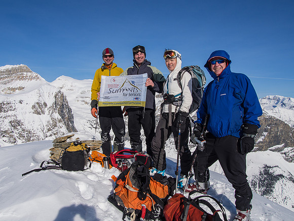 The group poses on the summit of Emerald Peak.