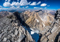 Gazing down the east face glacier and north towards Watermelon and Bobac peaks as we descend the summit ridge.