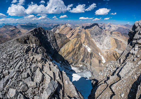 Gazing down the east face glacier and north towards Watermelon and Bobac peaks as we descend the summit ridge.