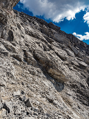 Looking back up the slabby terrain just under the summit ridge.