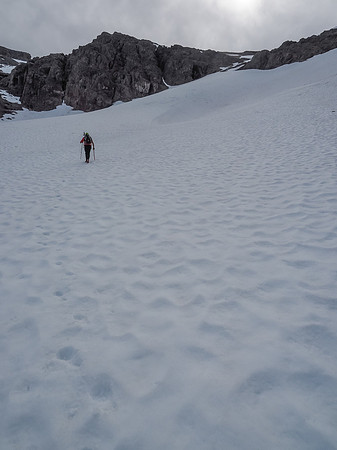 After cutting across the upper glacier, we will now trend back to our right via an obvious snow ramp leading up to the ridge.