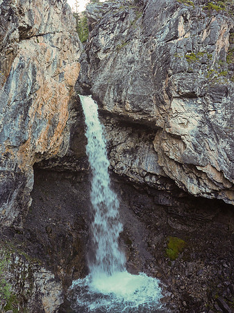 Helen Creek pours over a ledge and cascades into a pool below as we ascend steeply beside it.