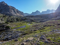 The sun makes it hard to spot but Watermelon Peak rises in the distance at right, Bobac at left.