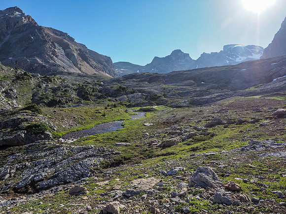 The sun makes it hard to spot but Watermelon Peak rises in the distance at right, Bobac at left.