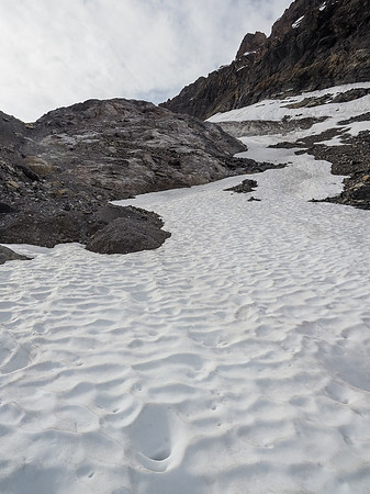 This slope was the steepest and our footwear proved capable right away. My aluminum crampons worked perfectly with my approach shoes on this mellow terrain.