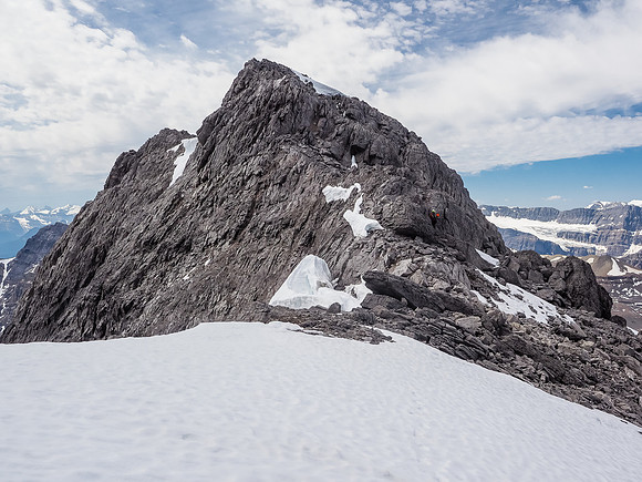 Phil re-ascends the ridge from the summit col.