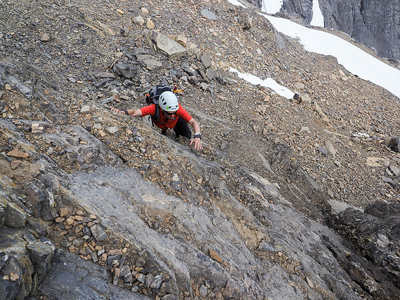 Phil starts up the crux below me.