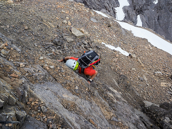 Phil starts up the crux below me.