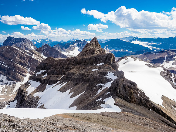 Phil waits at the col before we retrace our steps up the broken terrain of the south ridge.