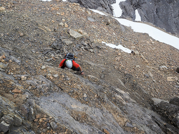 Phil starts up the crux below me.