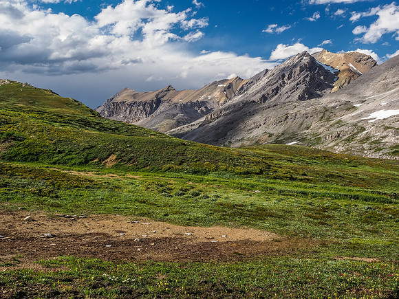 Looking back with great late afternoon lighting and a tstorm looming in the distance. Bobac at upper right.