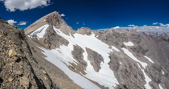 All that's left after the crux is finding the easy scree gully through the cliff band below us and then traversing easily to the col, sneaking past the giant cornice.