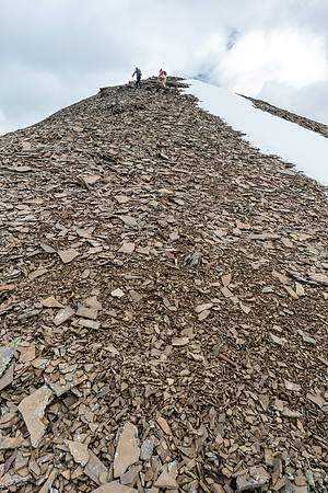 Easy scree slopes to the false summit on the west ridge of Wapiti Mountain.