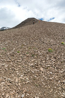Easy scree slopes to the false summit on the west ridge of Wapiti Mountain.