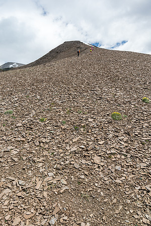 Easy scree slopes to the false summit on the west ridge of Wapiti Mountain.