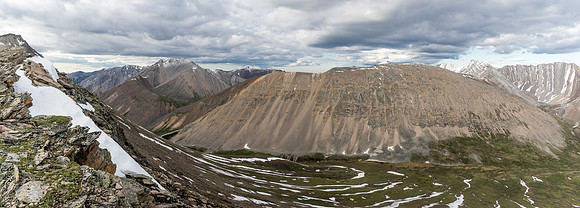 Hiking up the easy and scenic south slope of Chirp Peak with views of Divide Pass.