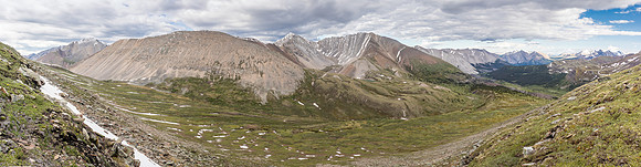 Views back to Divide Pass (L) from the east ascent slopes of Chirp Peak.