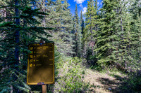 A new sign with the old one in the bg.